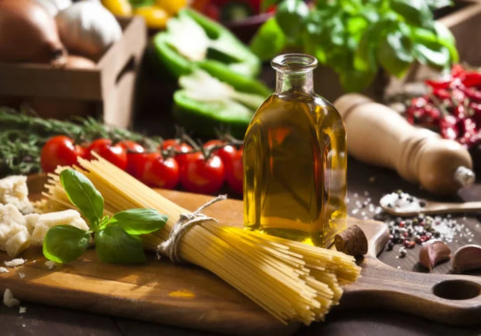 82e73003-2386-4aa8-975b-2d83aed2752d 1 (1) A wooden cutting board topped with pasta next to tomatoes.
